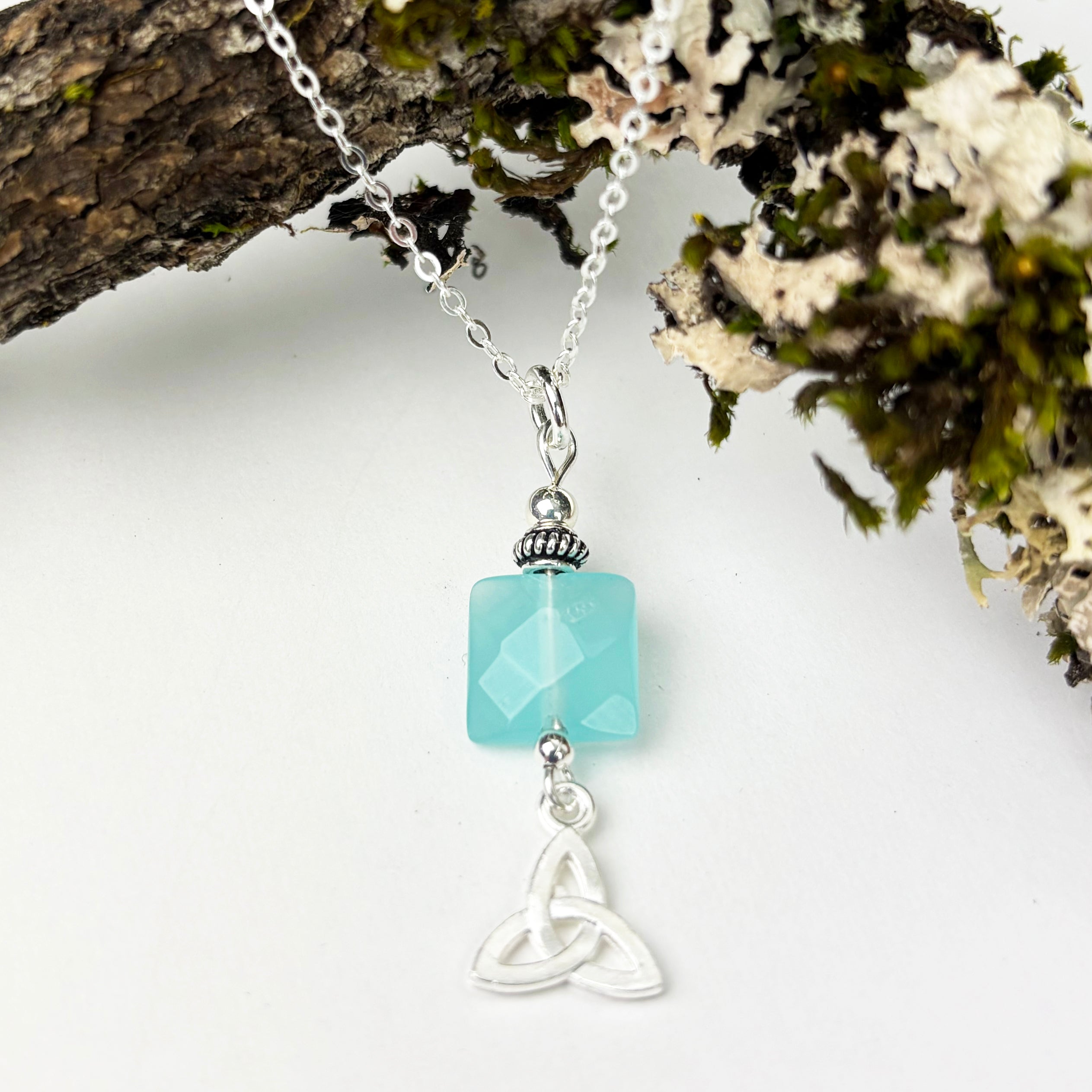 Square Faceted Chalcedony with Trinity Knot