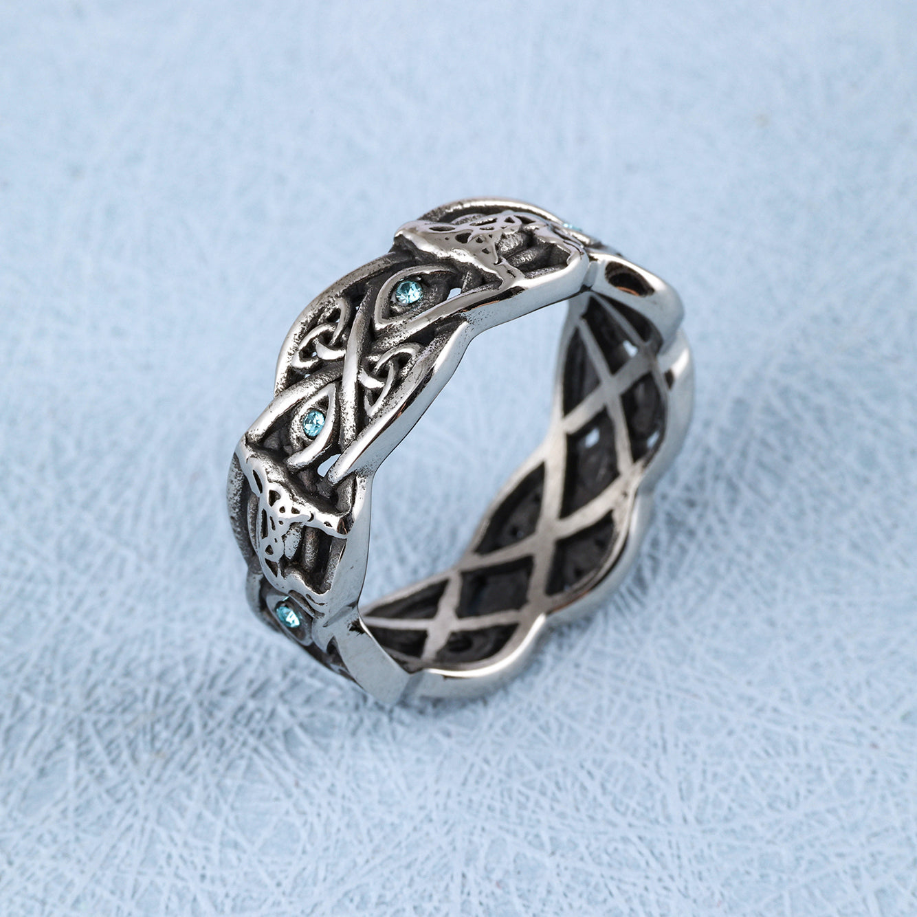 Open Celtic Knot with Faceted Teal Accents Band