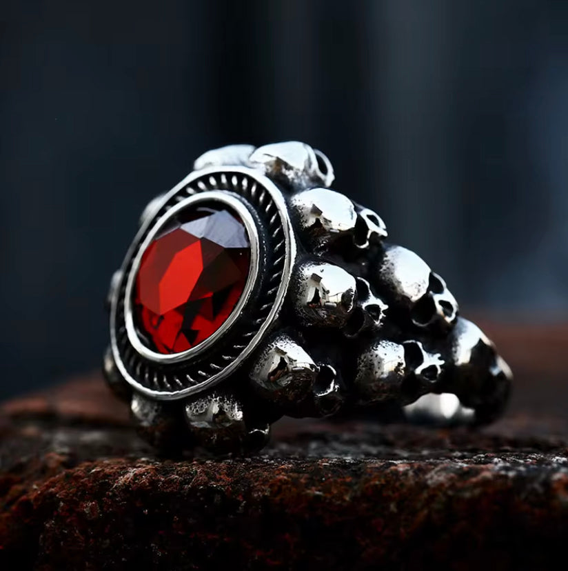 Red Faceted Center Stone Surrounded by Skulls