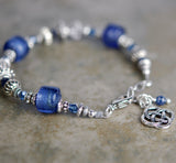 Bracelet with Sapphire Gemstones and Round Celtic Knot Drop