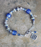 Bracelet with Sapphire Gemstones and Round Celtic Knot Drop